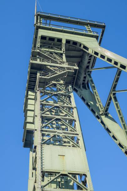 istock Winding tower looming against clear blue sky 2203610563