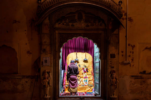 India. Rajasthan. Jaipur. Monkey temple (Galtaji temple). A priest officiates in a Hindu temple
