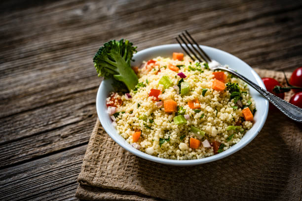 Tabbouleh couscous salad plate on rustic wooden table