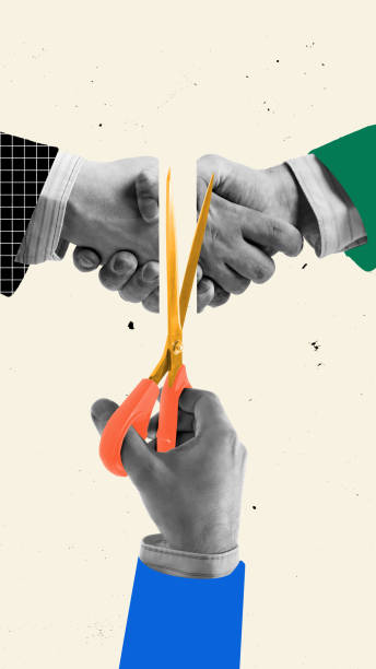 istock Business partnership breaking apart. Hands shaking while golden scissors sever connection. Photocopy effect. 2203614067