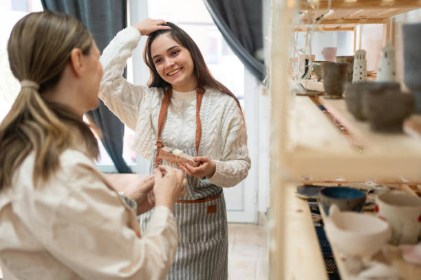 istock Women having a small talk before pottery class at pottery workshop 2203615157