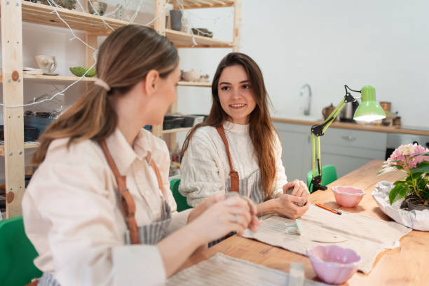 istock Friends on pottery class at a ceramics workshop 2203615201