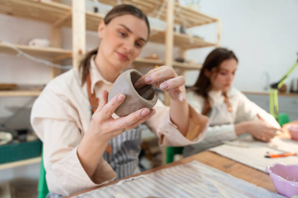 istock Friends on pottery class at a ceramics workshop 2203616328