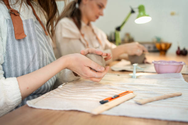 istock Women making handmade clay products at ceramic studio 2203617042
