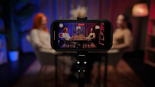 istock Two Influencers of women being interviewed in a loft-style podcast studio 2203617645