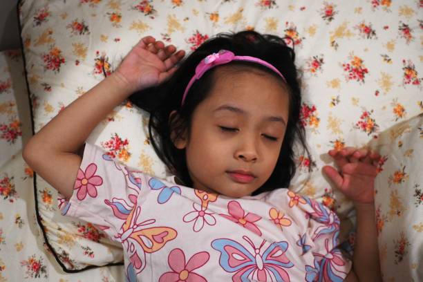 Portrait of a little girl sleeping in her bed