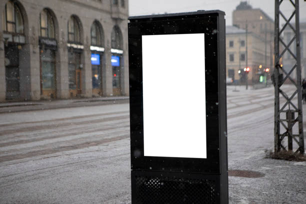 Digital display advertising template left blank for your own marketing messages. Photographed on a Helsinki street in winter.