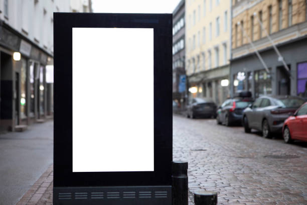 istock Digital display with copy space on a cobblestone city street in winter 2203618558