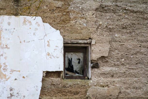 An abandoned building with broken windows