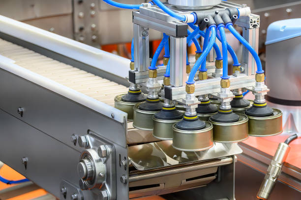 istock The high technology material handling process in canned food production by robotic system. 2203623728