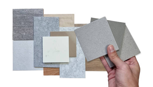 istock interior designer hold artificial stones to matching color with others material samples arranged appealing composition, including wood tiles, stone tiles. 2203626061