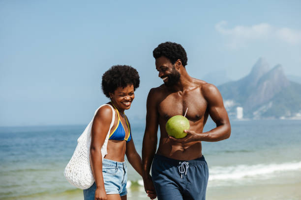 istock Young couple enjoying a beach day in Rio de Janeiro 2203626080