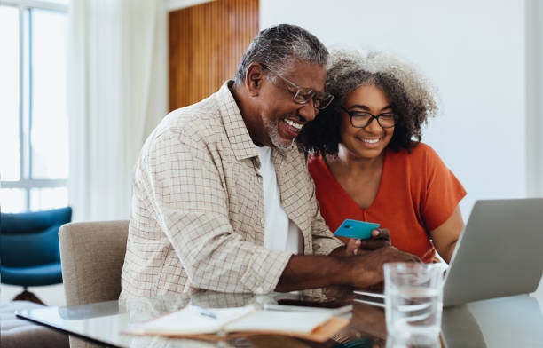 istock Fintech for Seniors: Confident grandparents making online payment while shopping together 2203627643