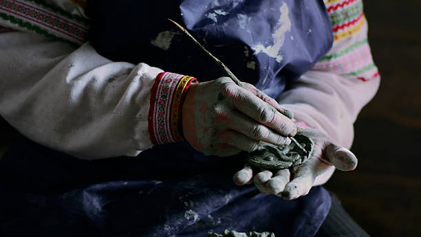 istock Close up of craftsman making pottery 2203628414