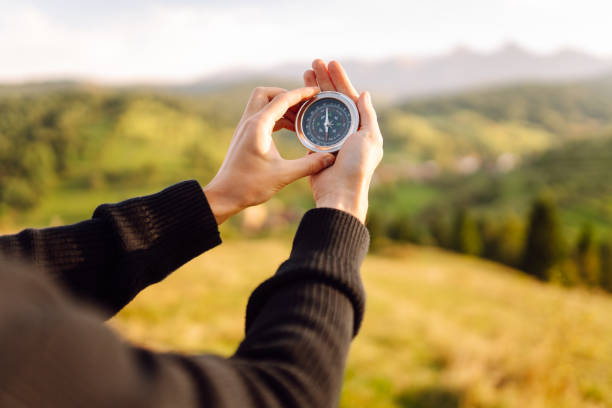 istock Close-up of tourist's hand with compass. 2203631786
