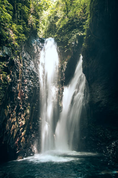 istock Serene Waterfall in Tropical Greenery Captured in Natural Lighting at Forest Reserve 2203632022