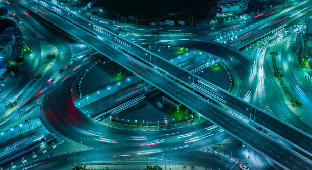 istock Road traffic on circle at night 2203634513
