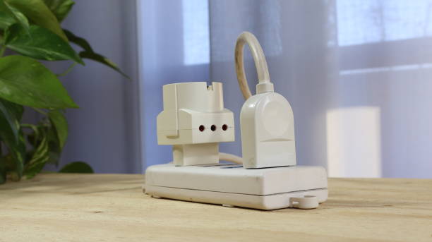 istock Electrical cables connected to power strip with german schuko plug in power strip 2203635623