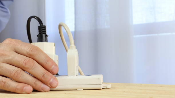 istock Insulated cables connected to the white color power strip 2203635632