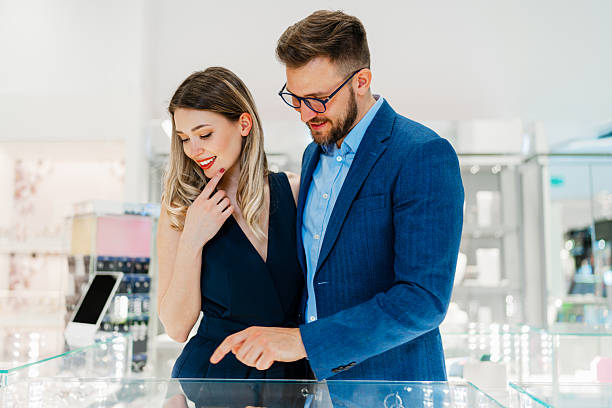 istock Attractive middle age couple in jewelry store 2203636697