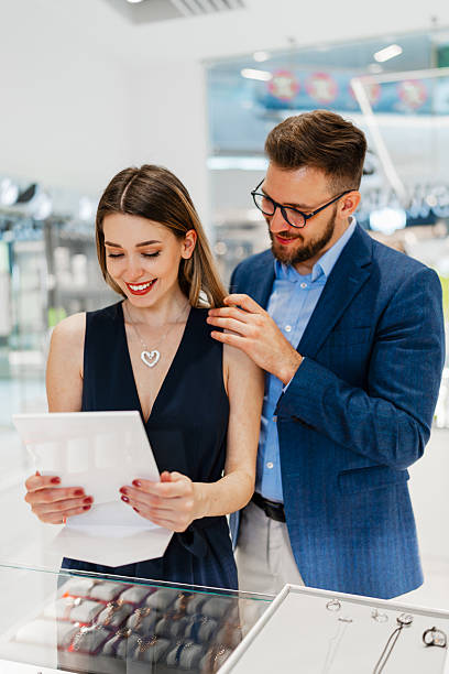 istock Attractive middle age couple in jewelry store 2203636703
