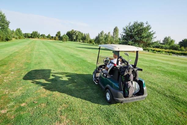 istock A golfer with a prosthetic leg practices their swing on a beautiful sunny day, utilizing an adaptive golf cart for support and mobility 2203637392