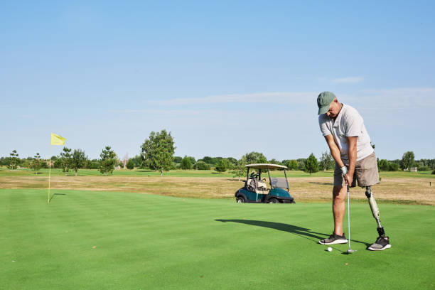 istock Golfer focusing on his swing while standing on the green, demonstrating skill and determination at a scenic golf course 2203637416