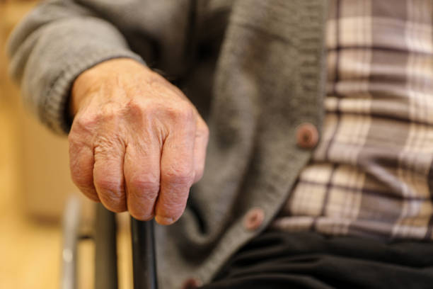 istock Elderly Hand on Wheelchair at a Nursing Home (80+) 2203638637