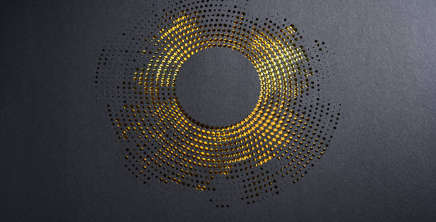 Modern abstract paper cutout artwork with circular perforations revealing gold accents on a dark textured background.