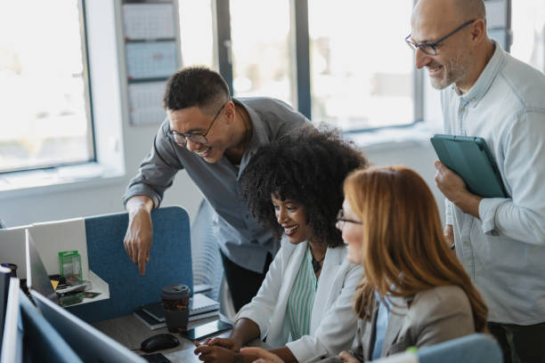 istock Team Celebrating Success at Corporate Workspace 2203642645