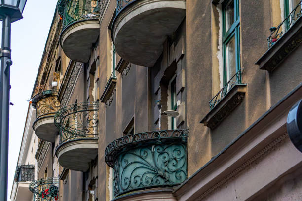 various old-fashioned balconies with beautifully decorated balustrades on a residential building in the city. urban architecture of the old town.