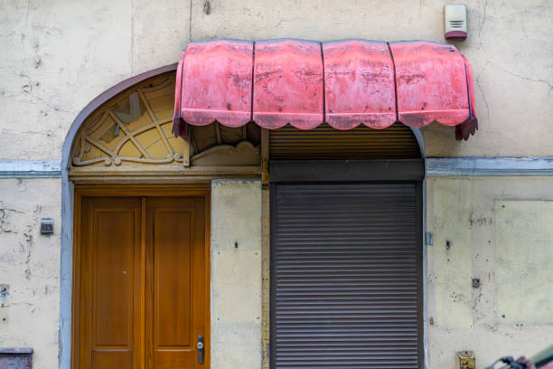 old fashioned red awning on building. curtain on apartment building.