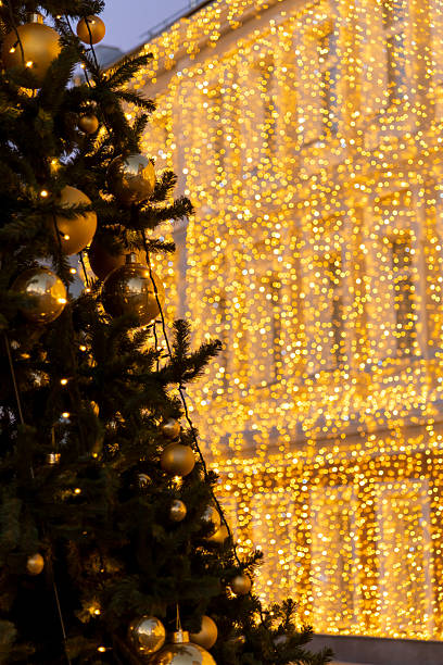 istock City square decorated with festive lights and a Christmas tree 2203648824