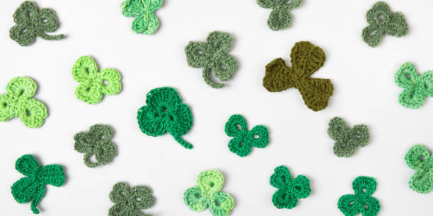 istock Knitted green shamrocks 2203650433