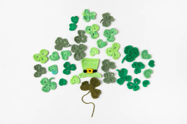 istock Knitted green shamrocks 2203650448