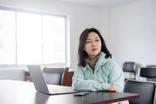 istock asian female working on laptop in office 2203653160