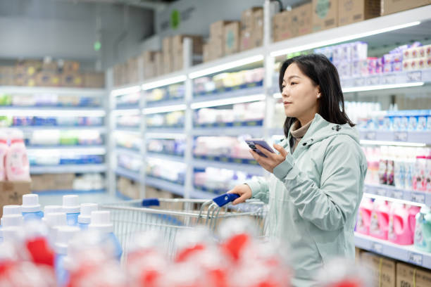 istock Asian women are buying laundry detergent. 2203655425