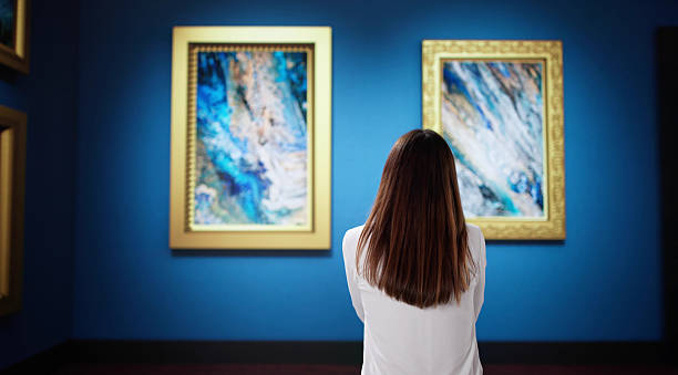 istock Admiring Unique Artwork at Museum Exhibition Featuring Abstract Paintings 2203656666