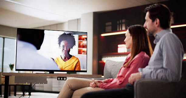 istock Evening Relaxation: Married Couple Enjoying Movie Night 2203658250