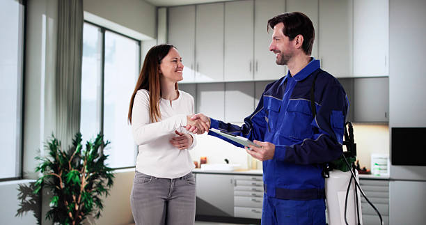 istock Pest Control Worker Presenting Invoice to Woman 2203659365