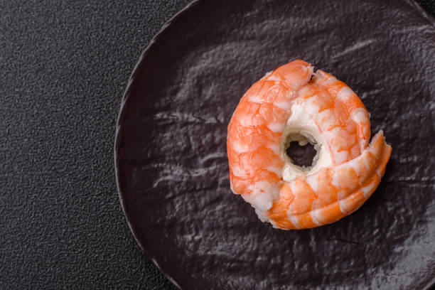 istock Donut shaped sushi rolls with salmon, shrimp and tuna 2203659524
