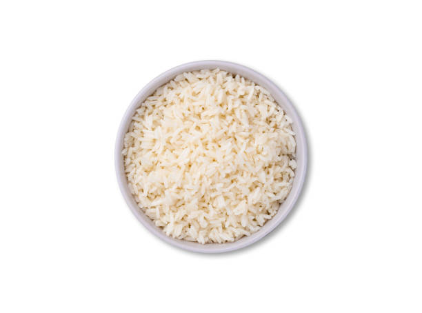 istock Cooked white rice in a bowl isolated over white background 2203662635