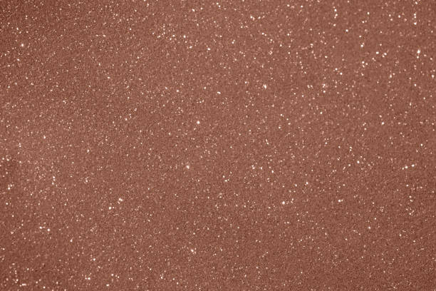 istock Glittering brown textured background with shimmering sparkles creating a festive ambiance 2203662665