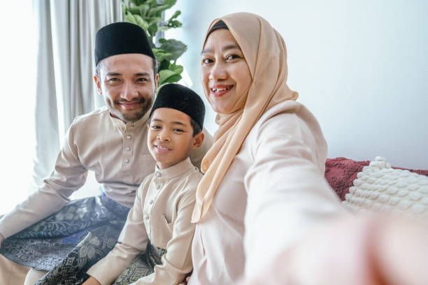 istock Eid Smiles: A Family Selfie at Home on Hari Raya 2203664254