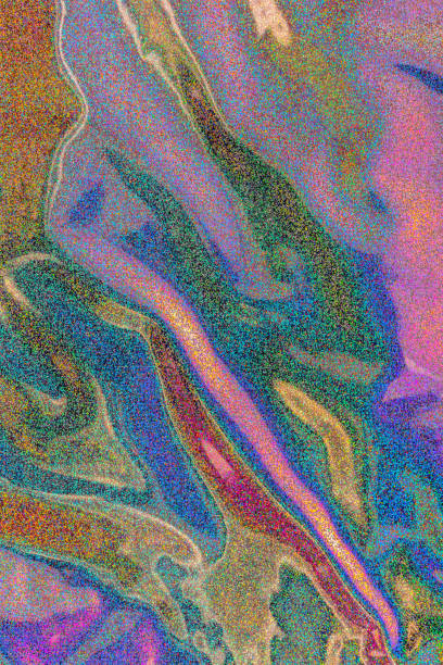 Holographic metallic foil with a small pattern, shimmering in different colors. Texture of holographic foil.