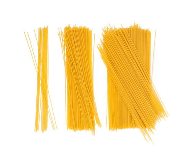 istock Raw spaghetti isolated, dry spagetti, long wheat noodles, uncooked italian macaroni bundle 2203665651