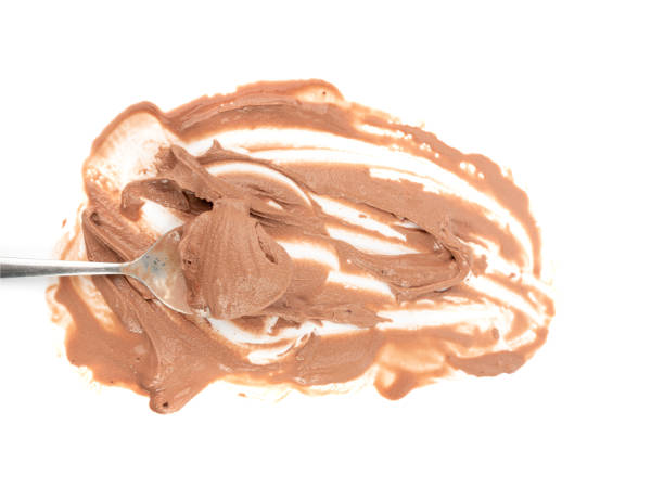 Melted chocolate ice cream isolated, real melting cocoa icecream drops, chocolate ice stain puddle on white background