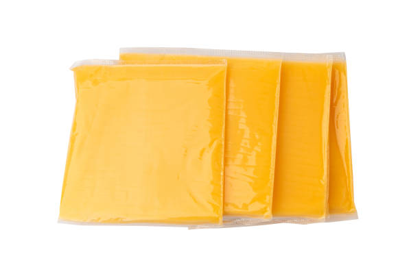 istock American cheese, processed cheese slice, wrapped thin yellow cheddar in a plastic package 2203665878