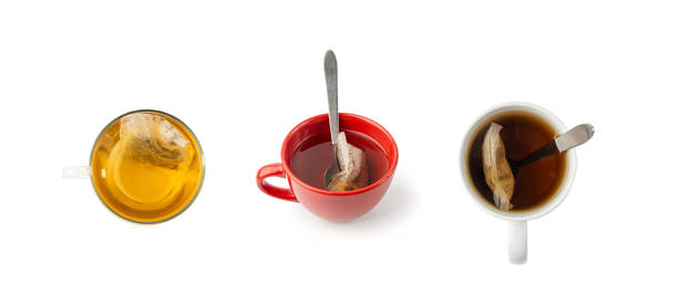 istock Herbal tea sachet in cup, hot water with chamomile and Hypericum or St. John's wort teabag 2203665904