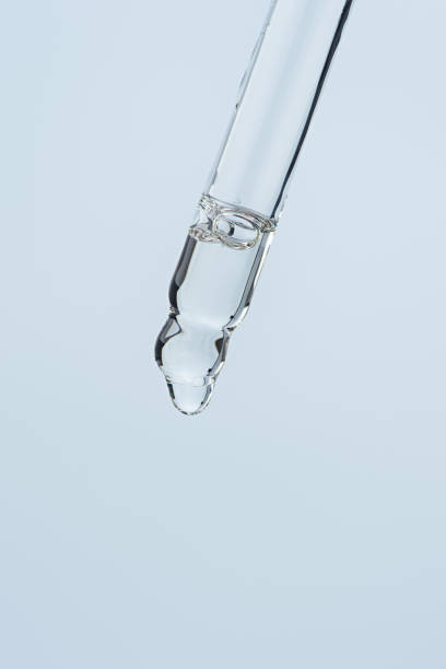 istock Cosmetic pipette with oil, macro 2203675182